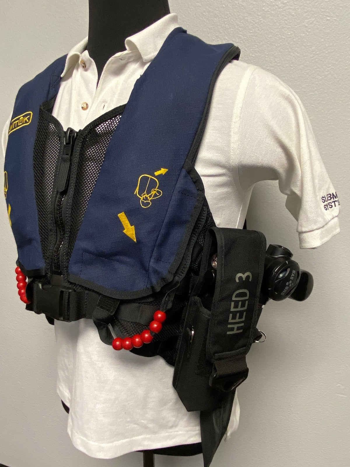 Mounted on a MOLLE vest (vertical) - vest sold separately
