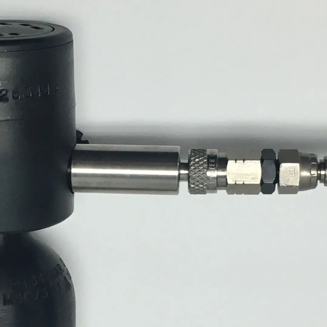 Spare Air mini scuba cylinder being filled using a high-pressure hand pump with refill adapter.
