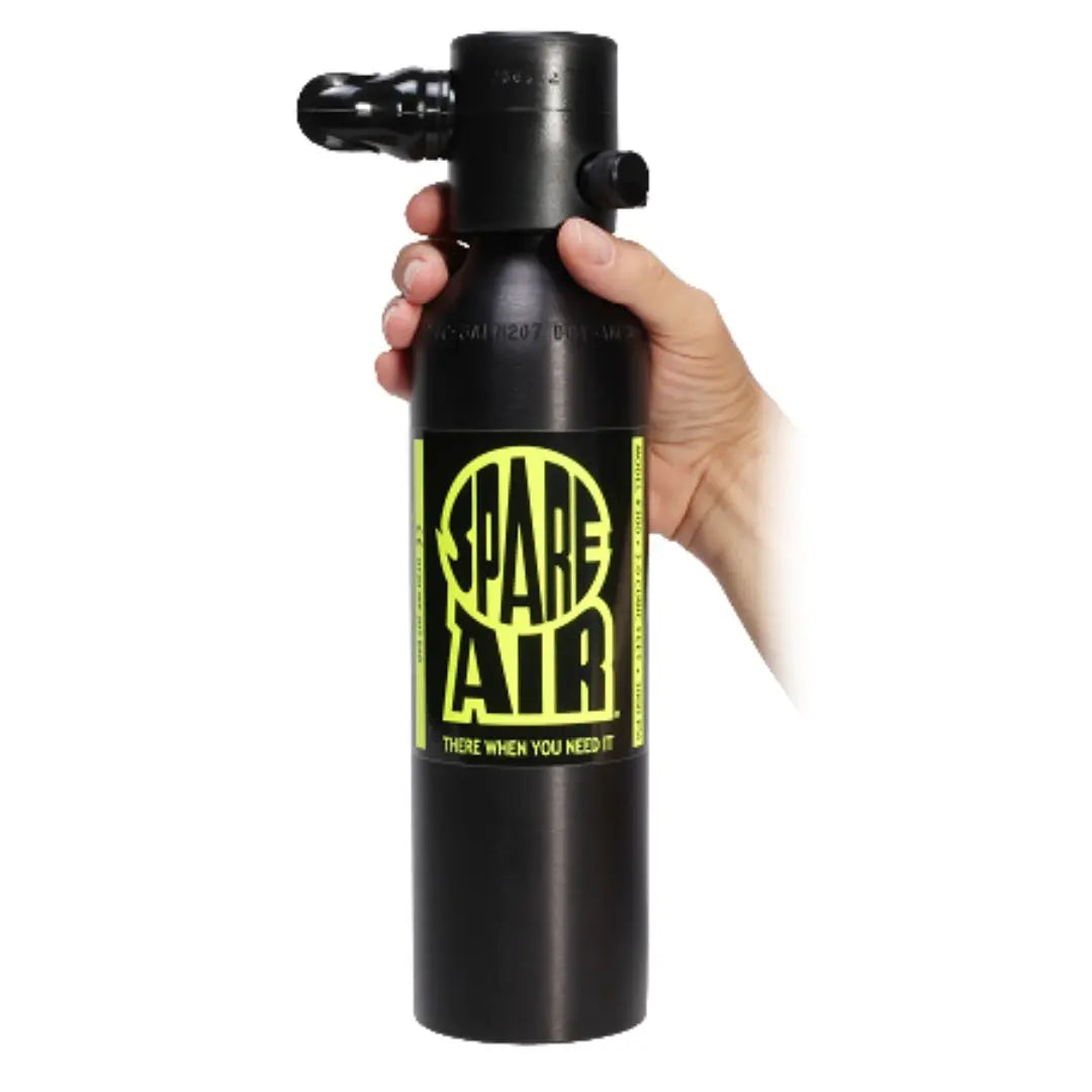 Hand holding a Spare Air 600 cylinder to demonstrate the size and design of the 6.0 cubic foot unit.
