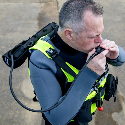 Holster mounted on back of PFD